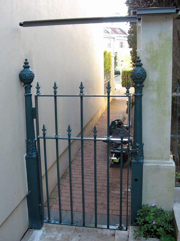 Clear acrylic was used to raise the height of this gate while still allowing natural light into the courtyard.