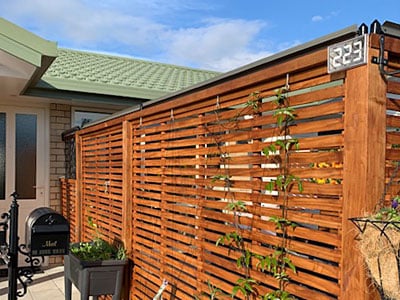 Oscillot system on timber lattice fence