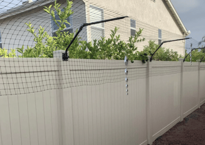 Purrfect Fence on a PVC fence