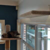 Cat pad attached to wall over door